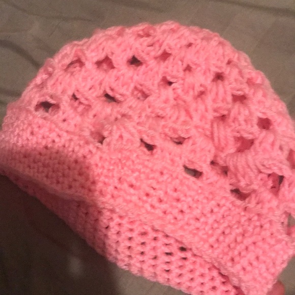It is a pink hat and cozy to wear for the winter. - Picture 2 of 3